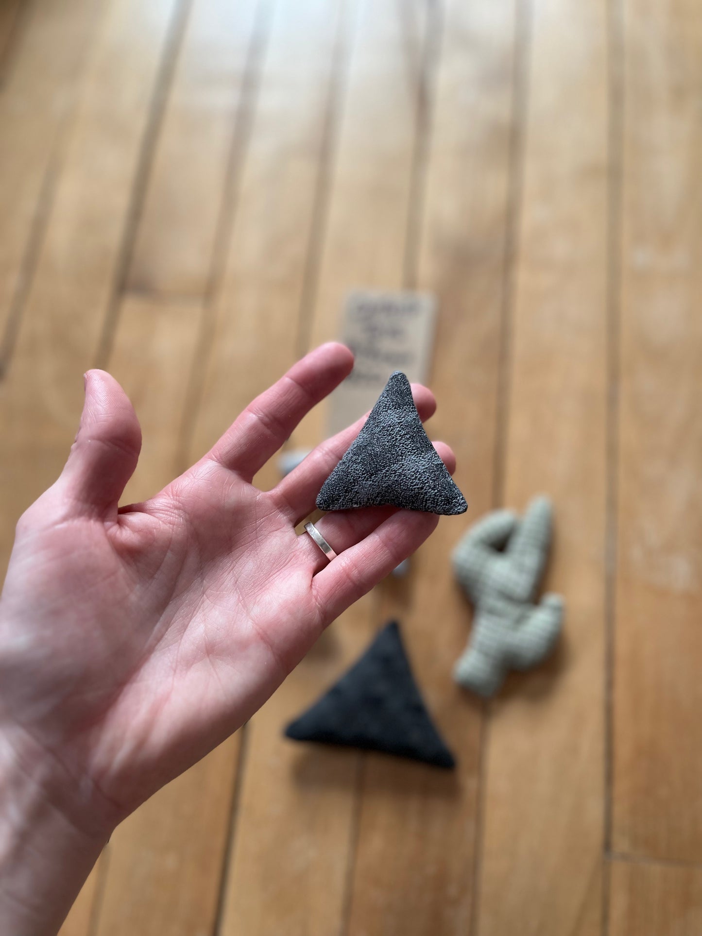 black checkered triangle catnip toy